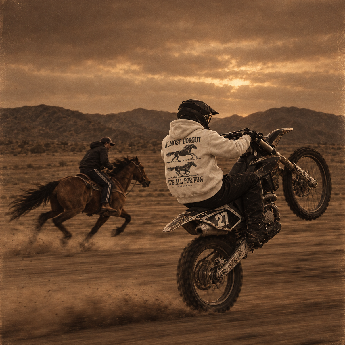 All for Fun hoodie worn by a helmeted dirt-bike rider beside a horseback rider in the desert