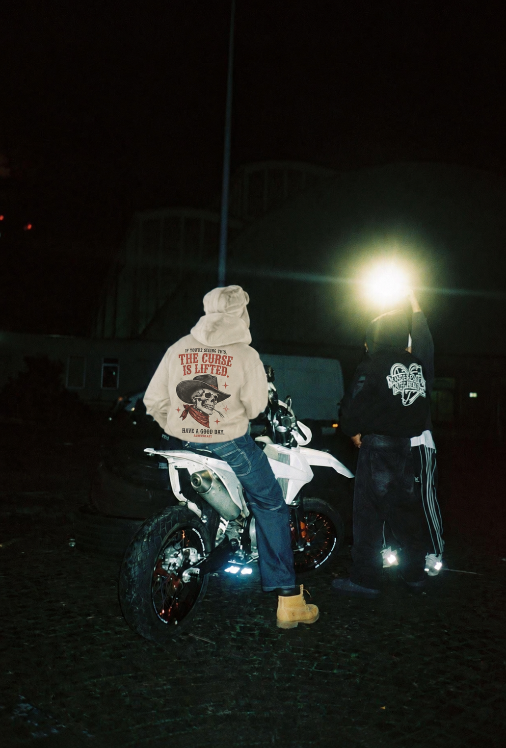 RANGEHEART Curse Lifted Boxy Hoodie worn in its candid lifestyle scene