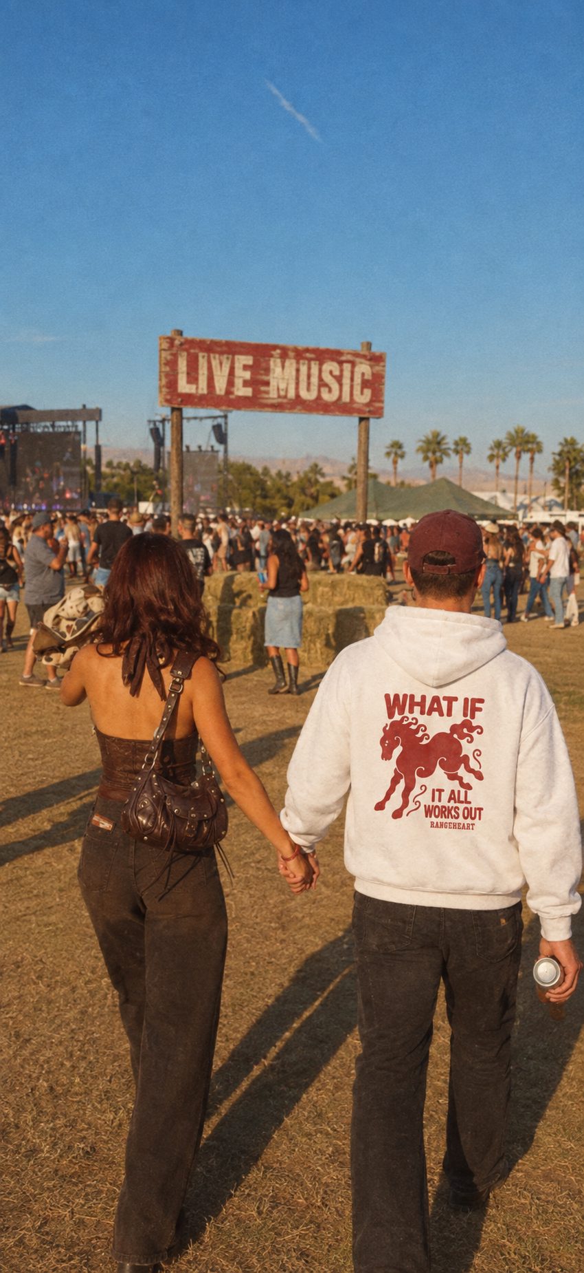 White What If hoodie back graphic at an outdoor music festival