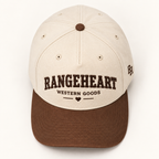 Western Goods Cap in Cream / tobacco — overhead view