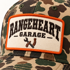 Garage Cap in Woodland camo / orange — embroidery detail
