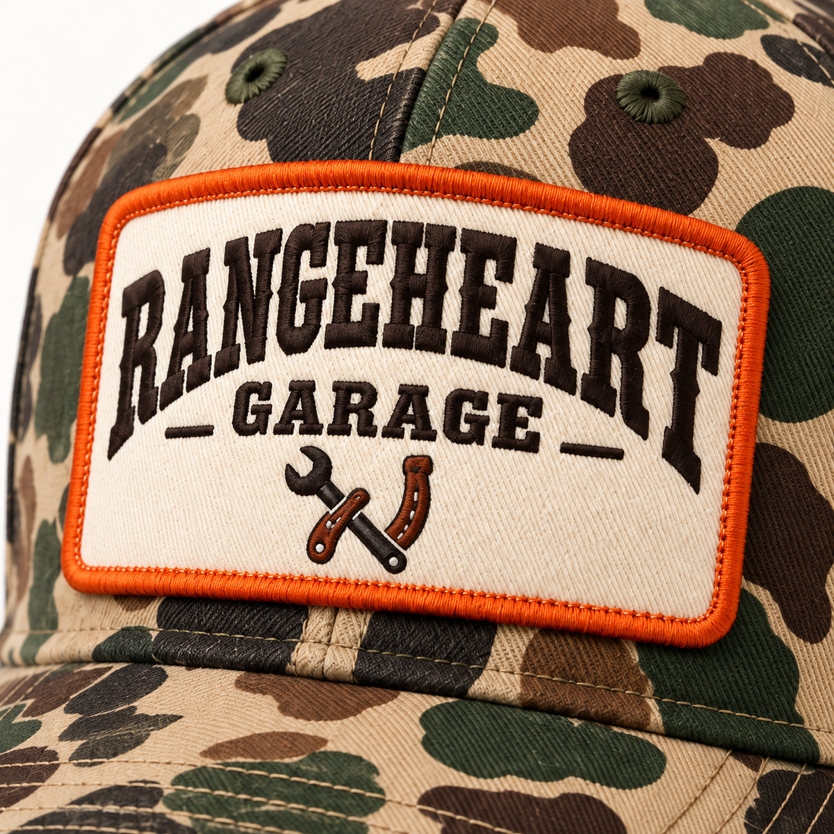 Garage Cap in Woodland camo / orange — embroidery detail