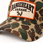Garage Cap in Woodland camo / orange — brim detail