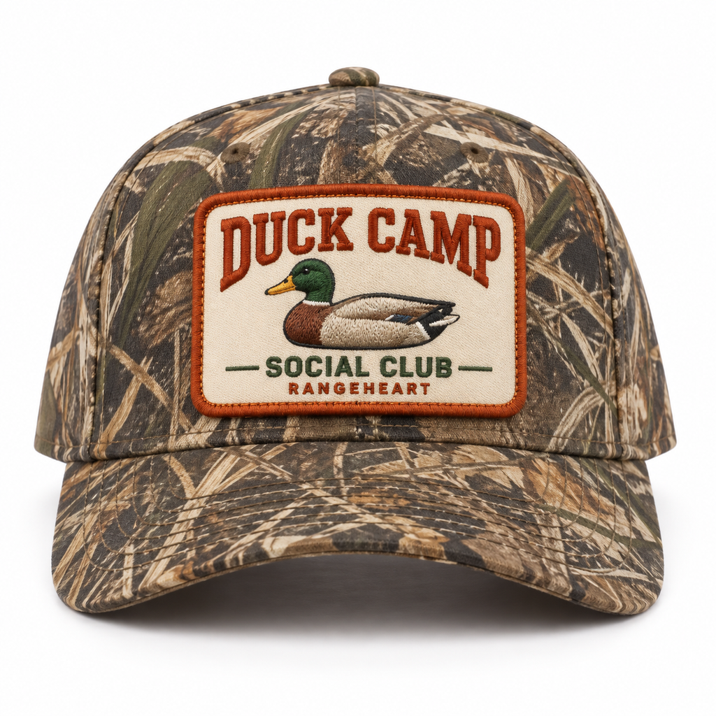Duck Camp Social Club baseball cap in Woodland camo / orange — front view